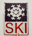 SKI Snowflake Embossed Metal Sign